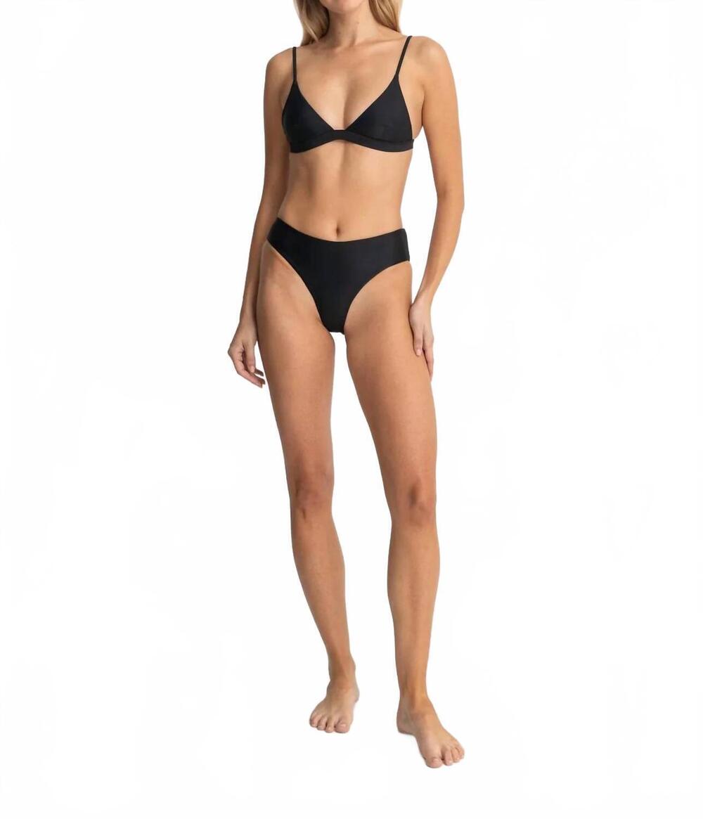 NEW RHYTHM. classic holiday seamless pant in black